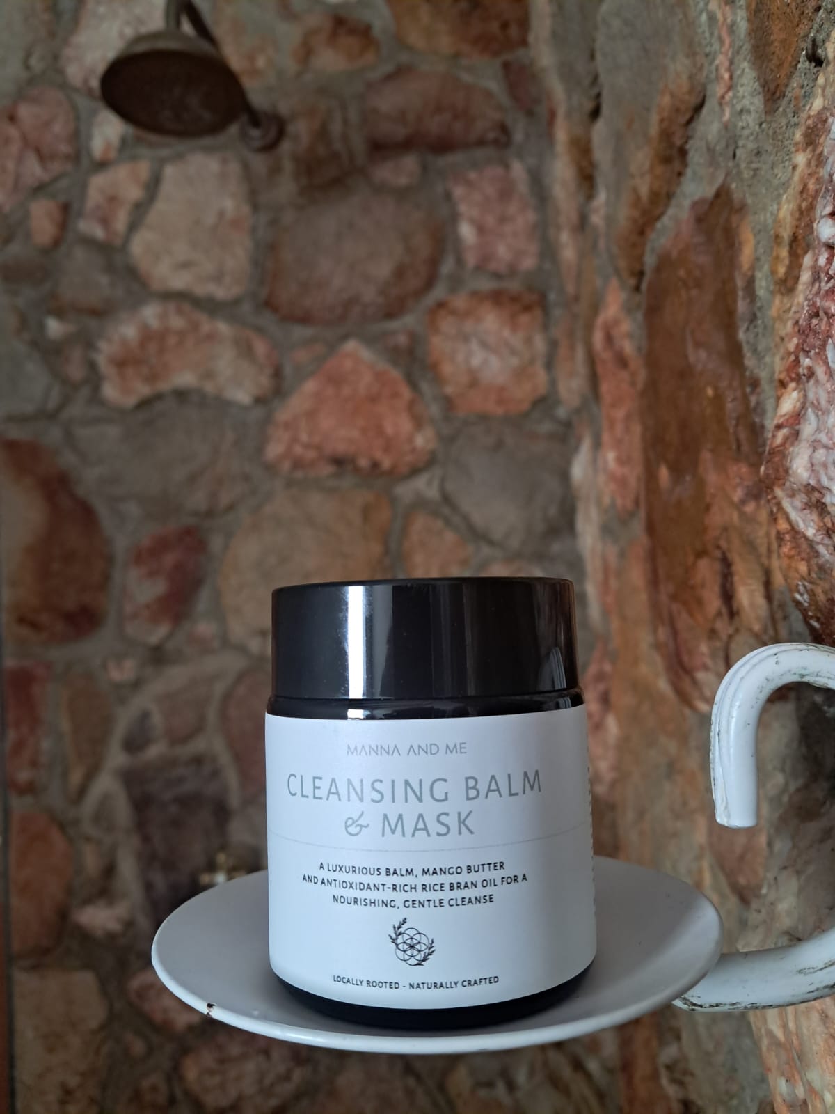 Manna and Me Cleansing Balm and Face Mask jar, soothing botanical oil-to-milk daily cleanser.