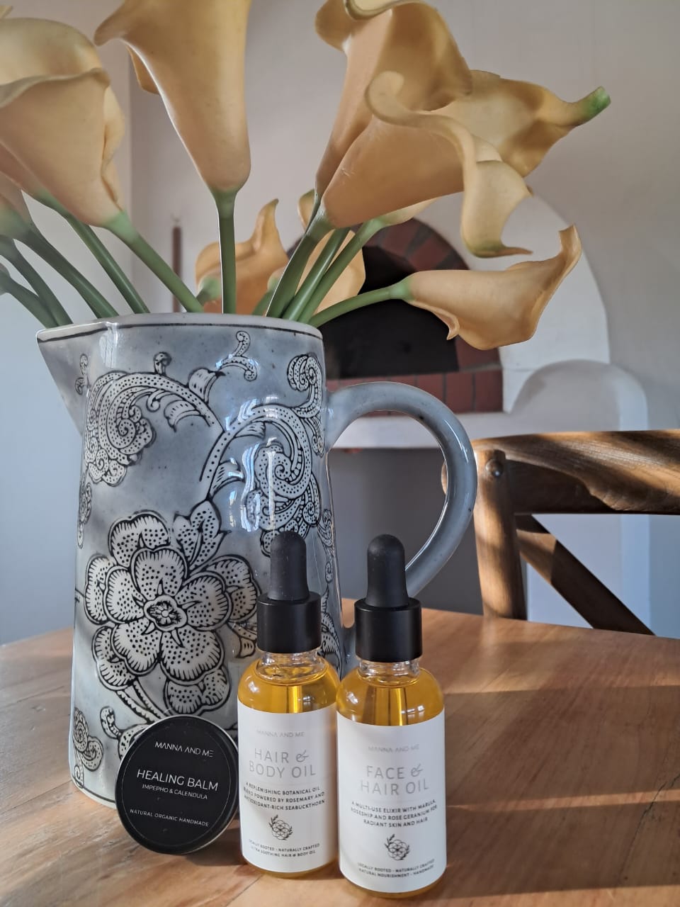 Manna and Me concentrated Face & Hair Oil dropper bottle, restorative South African botanical blend.