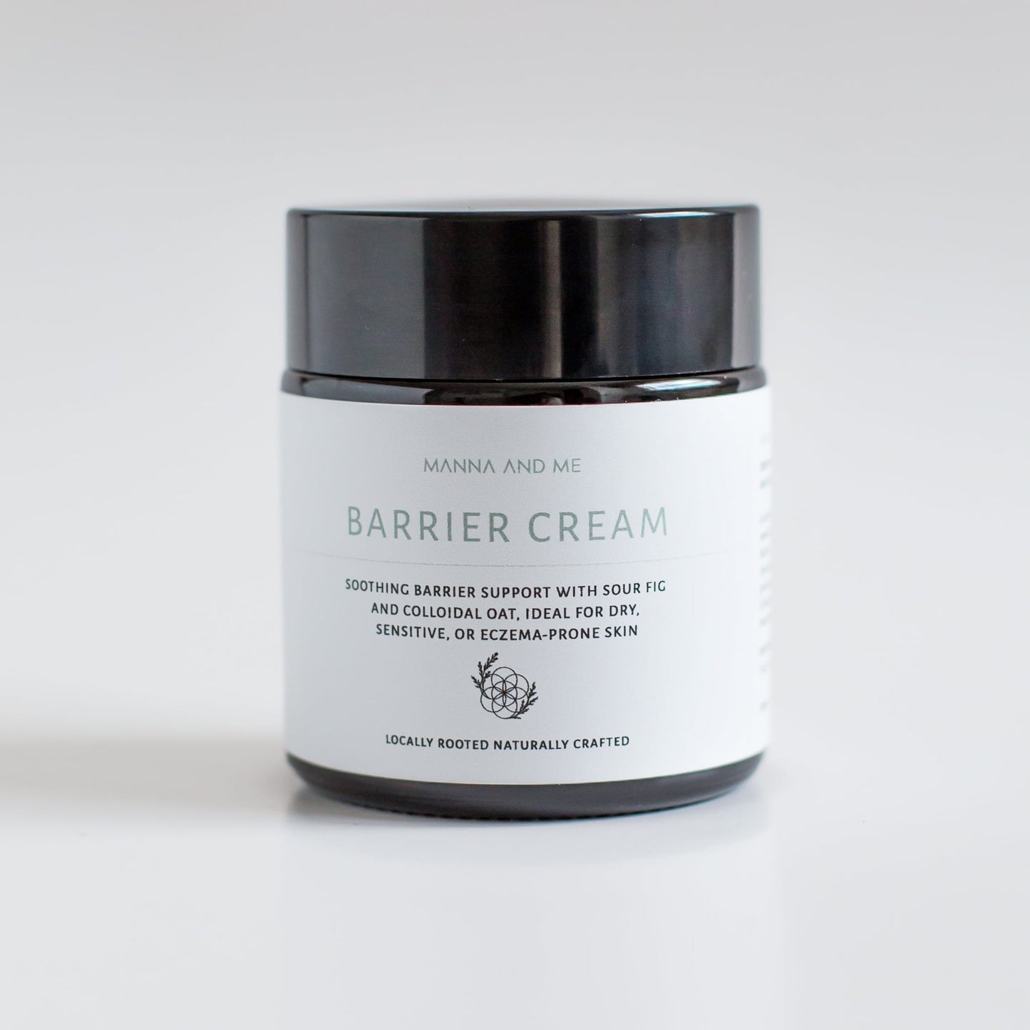 Manna and Me Barrier Cream glass jar, rich natural skin food for soothing dry, itchy, and eczema-prone skin.