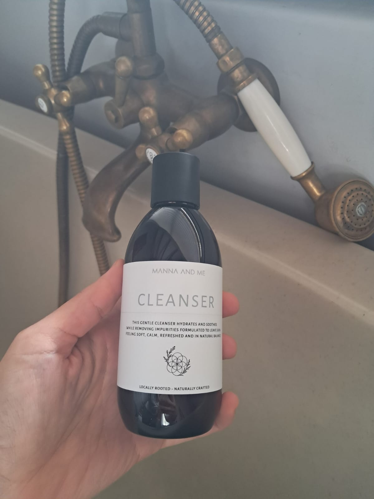 Manna and Me gentle botanical facial Cleanser bottle, purifying formula designed for sensitive skin barrier.