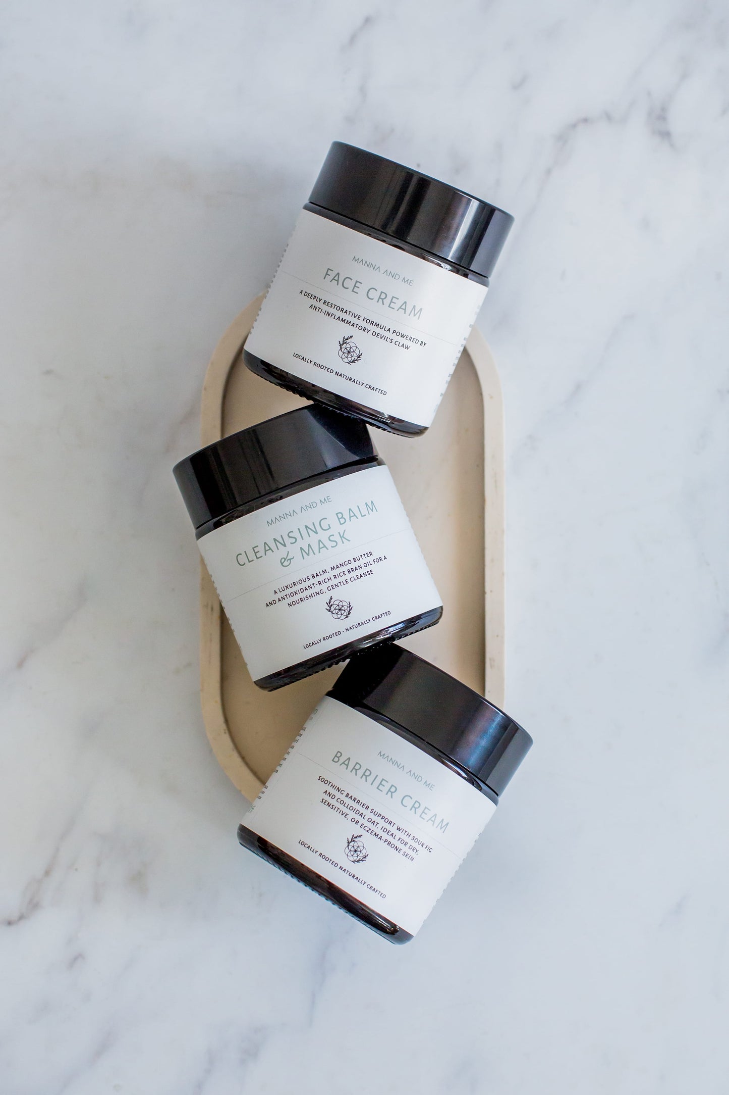 Manna and Me Cleansing Balm and Face Mask jar, soothing botanical oil-to-milk daily cleanser.
