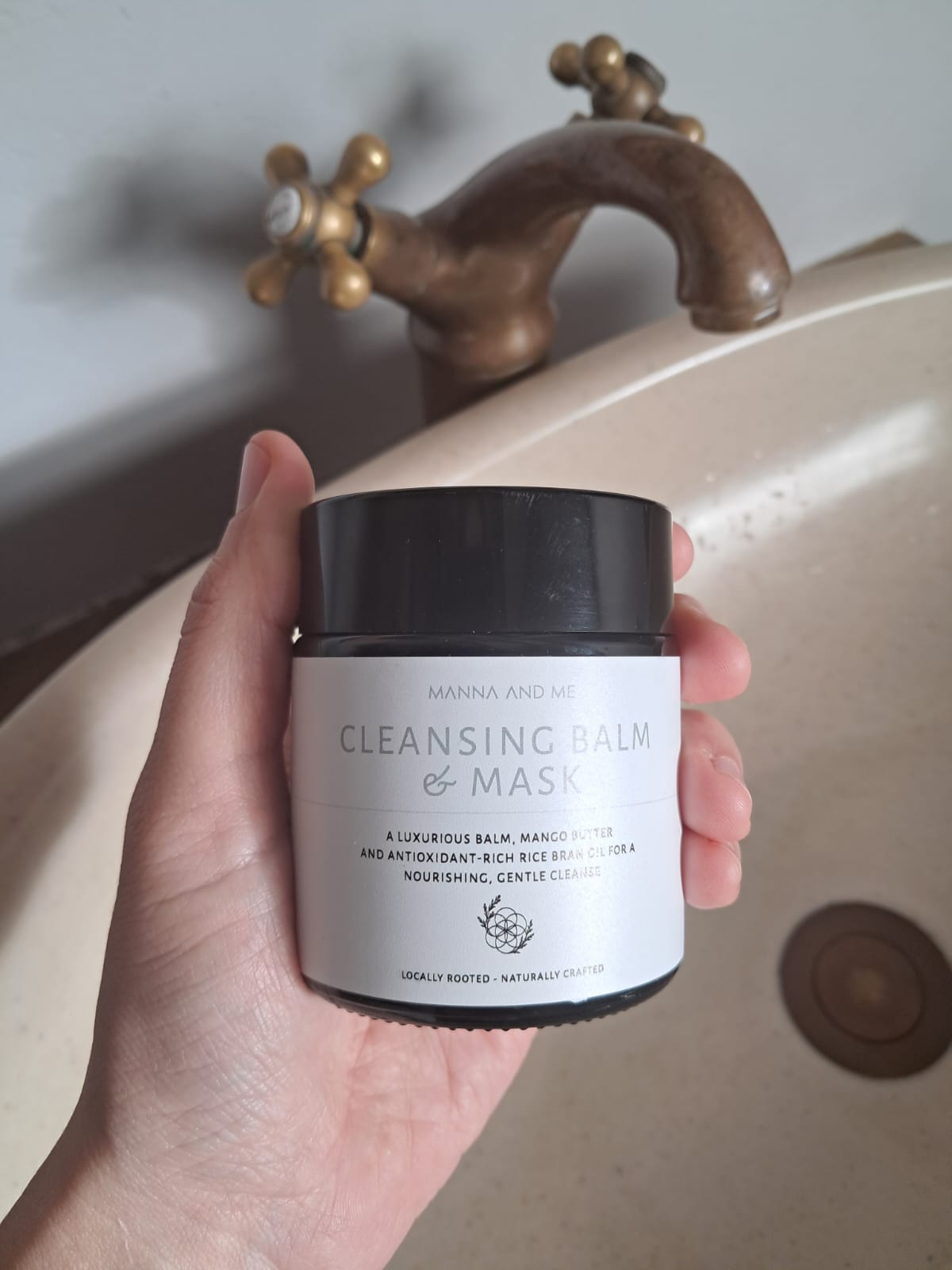 Manna and Me Cleansing Balm and Face Mask jar, soothing botanical oil-to-milk daily cleanser.