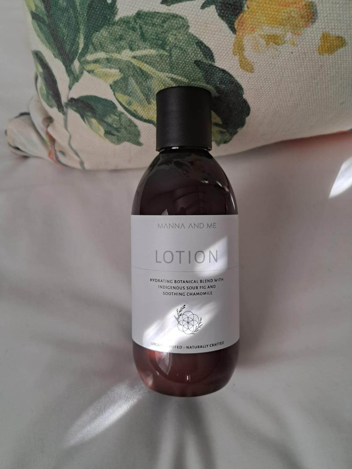 Manna and Me gentle daily Body Lotion bottle for soothing dry, sensitive, and reactive skin.