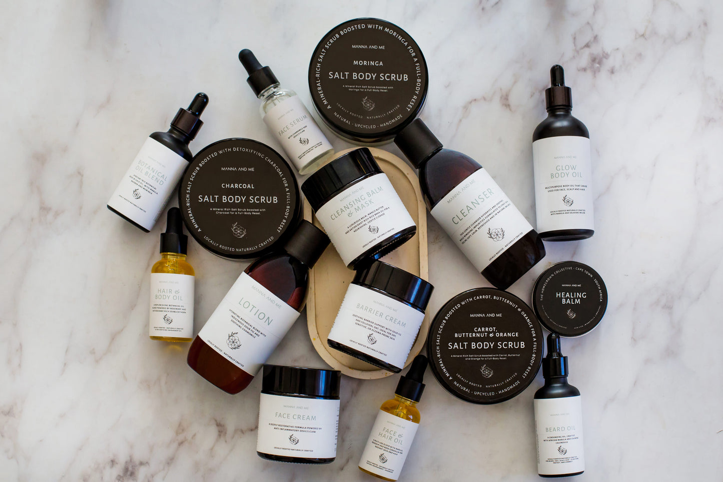 Manna and Me multi-use Hair and Body Oil glass bottle with natural botanical plant oils.