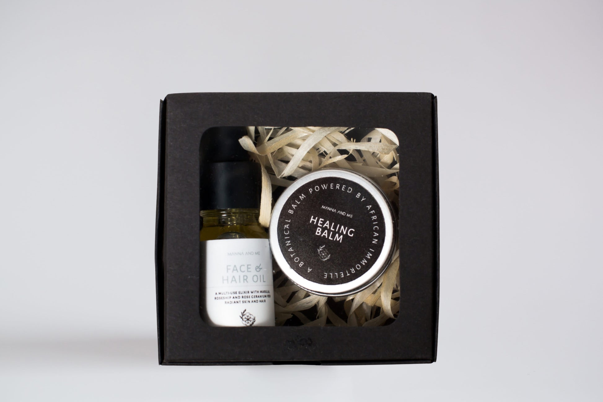 Manna and Me intensive Healing Balm tin, natural soothing salve for dry skin patches and irritations.